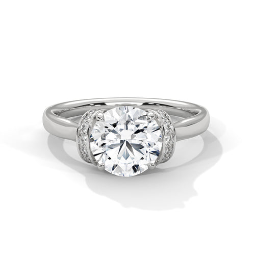 Round brilliant lab-grown diamond engagement ring with a shimmering hidden halo and polished white gold band.