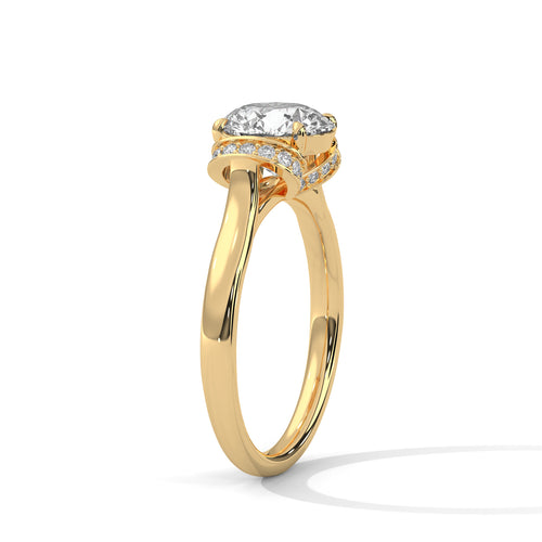Angled shot of a round lab-grown diamond ring with a hidden halo in yellow gold.