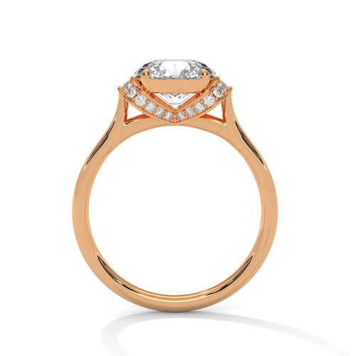 Detailed side view of a round diamond hidden halo mount in polished rose gold.