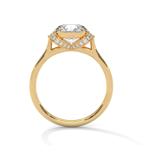 Side profile of a four-prong hidden halo setting in polished yellow gold.