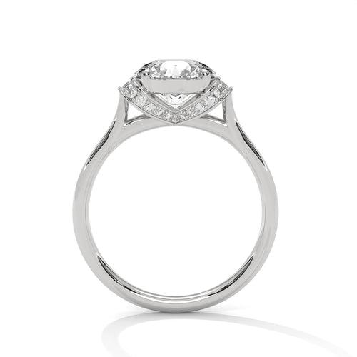 Side view of a round diamond engagement ring showcasing the pavé-set hidden halo in white gold.