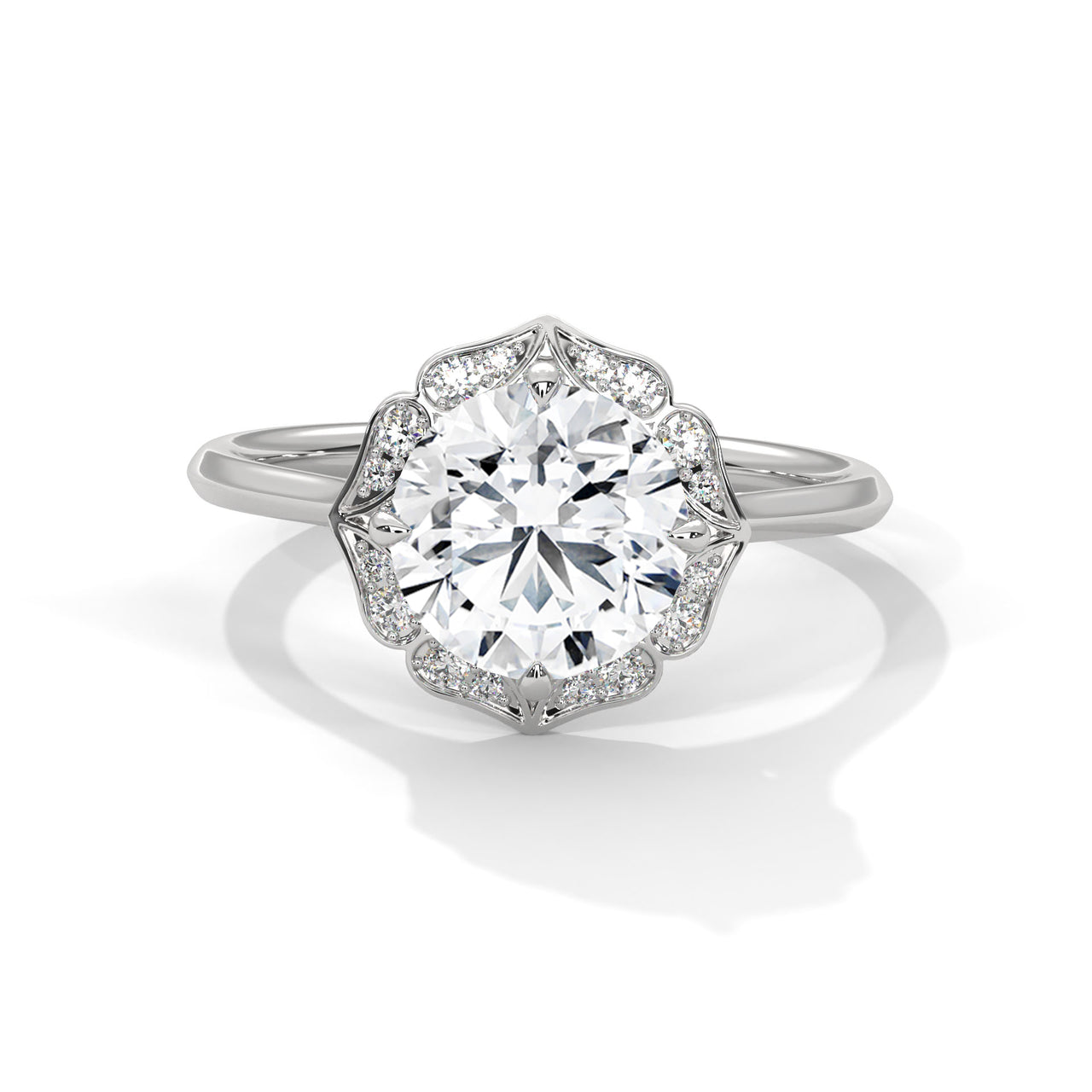 Round brilliant lab-grown diamond engagement ring featuring a scalloped floral halo and a polished white gold cathedral band.