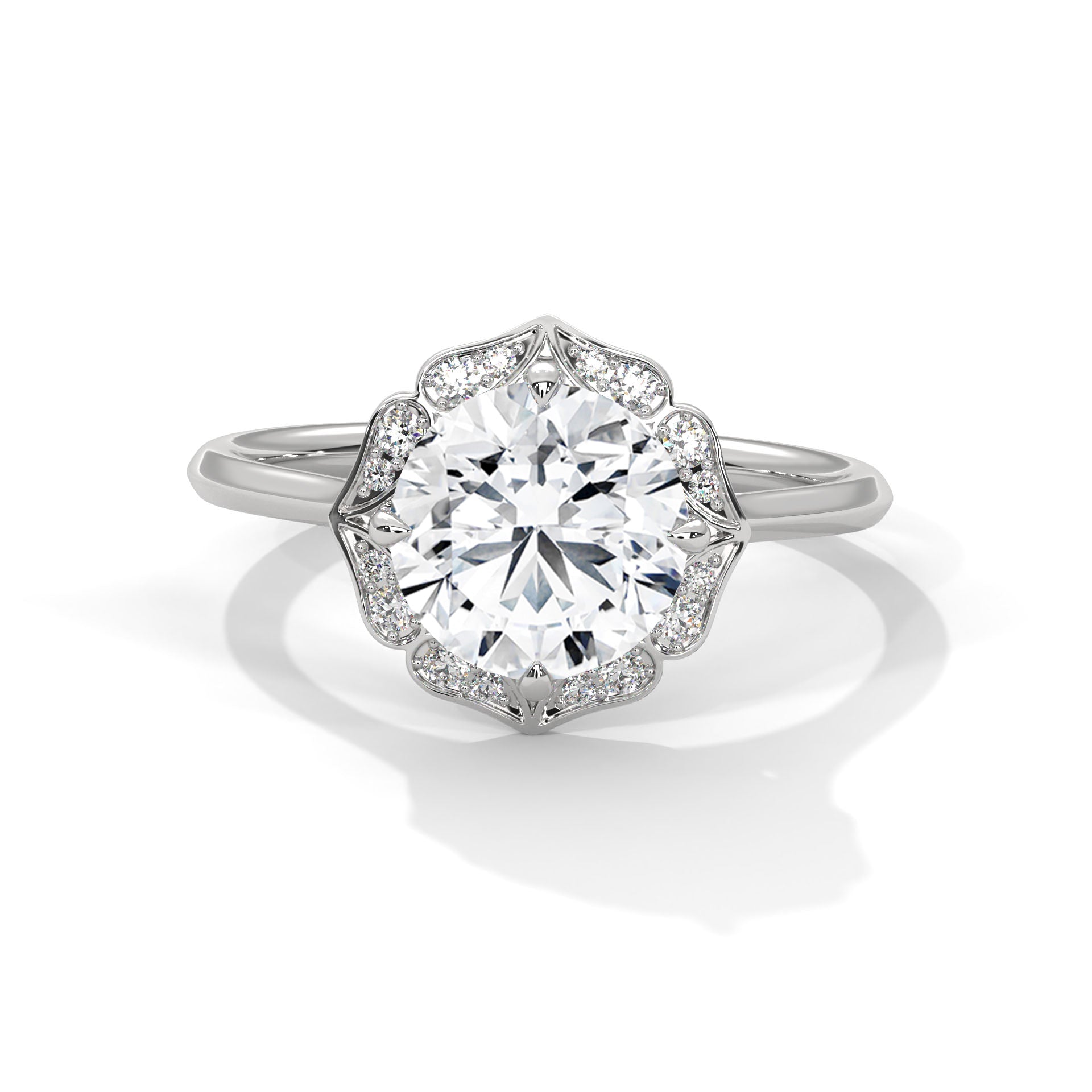 Round brilliant lab-grown diamond engagement ring featuring a scalloped floral halo and a polished white gold cathedral band.