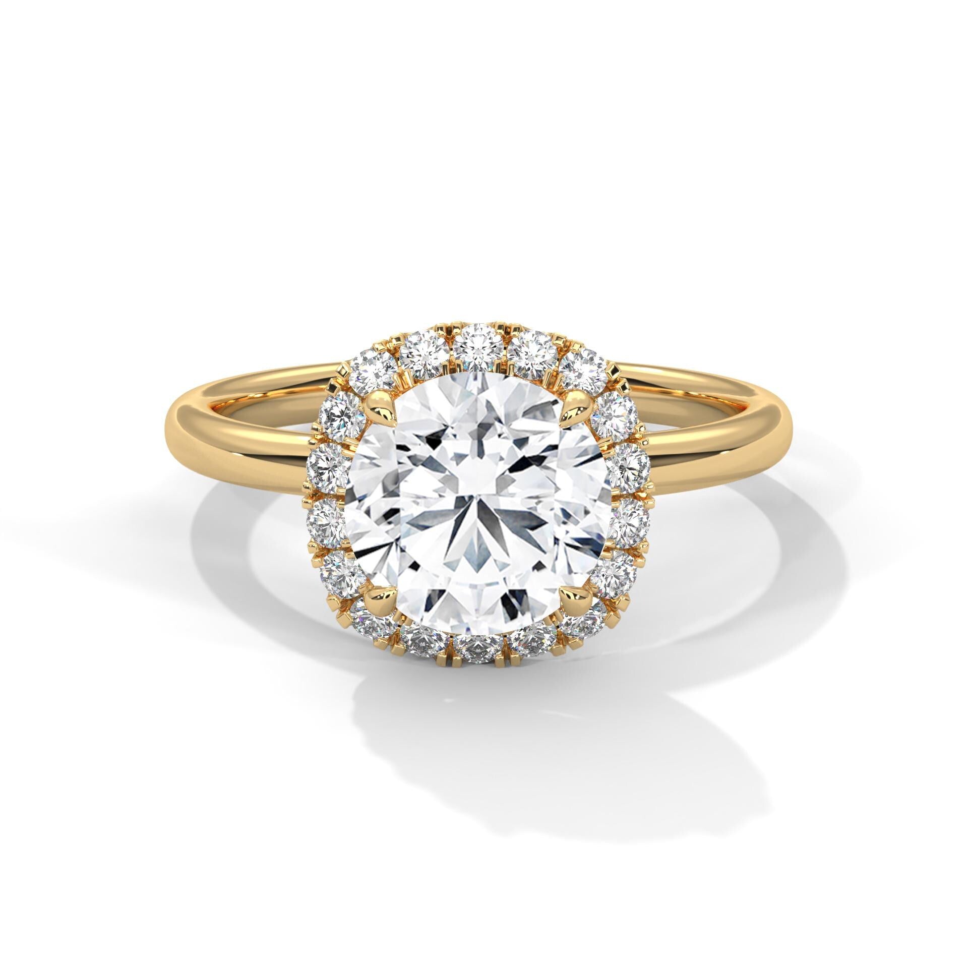 Colorless round cut lab diamond pave halo ring in yellow gold