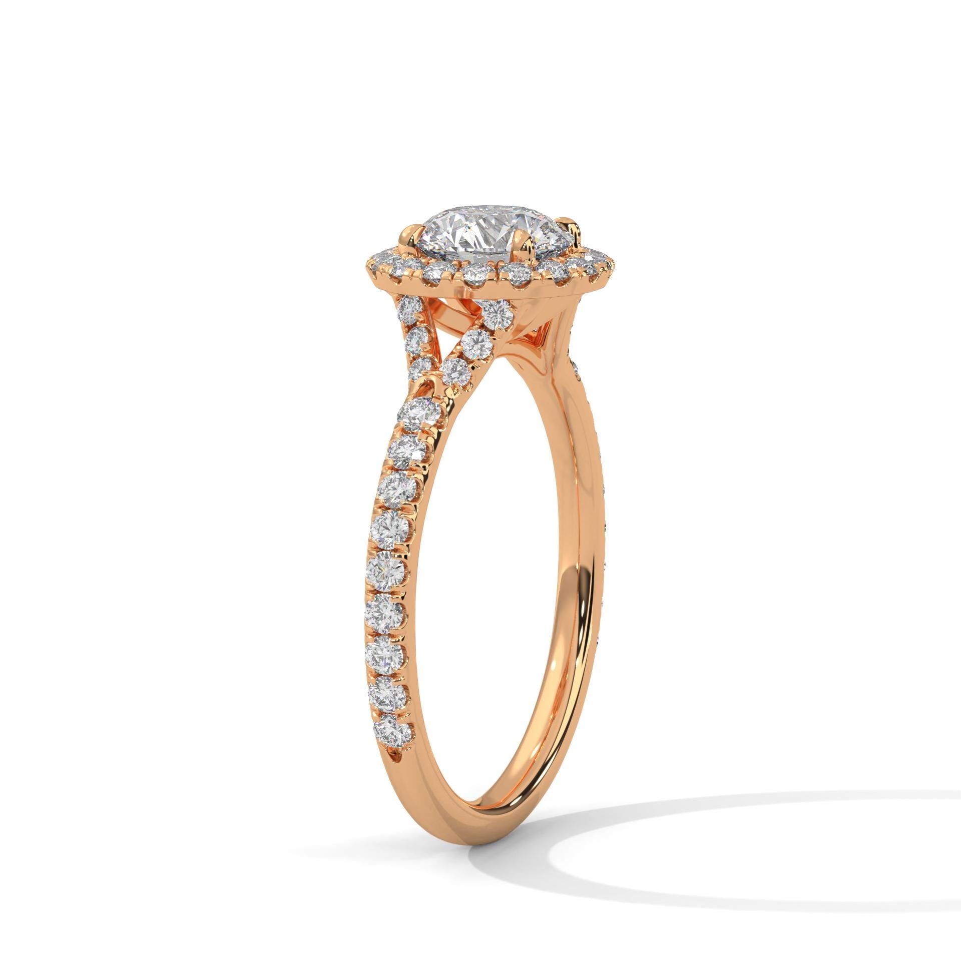 Underside view of rose gold halo setting for round brilliant diamond.