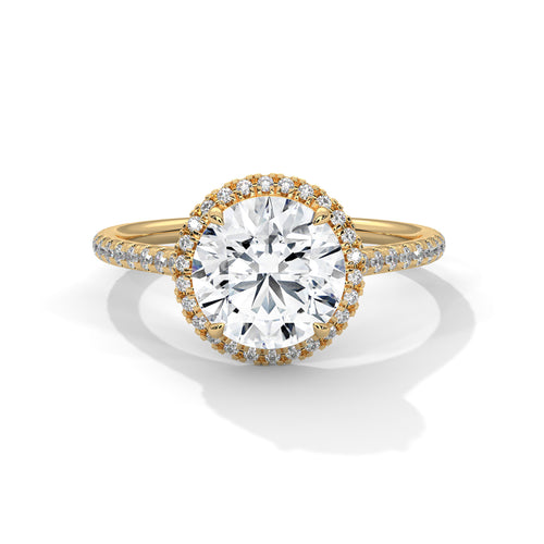 Round brilliant lab-grown diamond halo ring with a pavé-set band in solid 14k yellow gold.