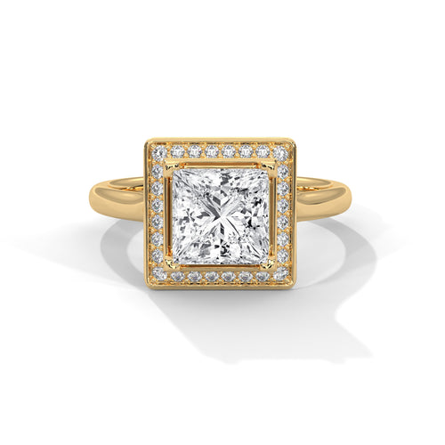 Princess cut elevated square halo engagement ring in yellow gold, angled front view showing tiered plinth platform and halo detail