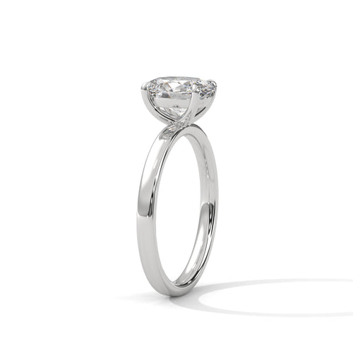 Oval solitaire plain band engagement ring in white gold, angled side view showing 4-prong setting and plain band