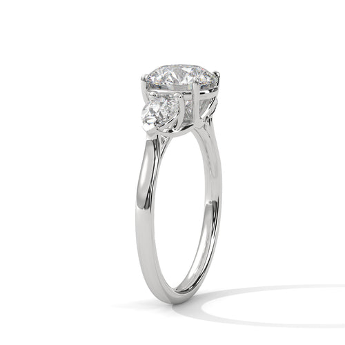 Angled perspective of a three-stone lab-grown diamond ring in polished white gold.