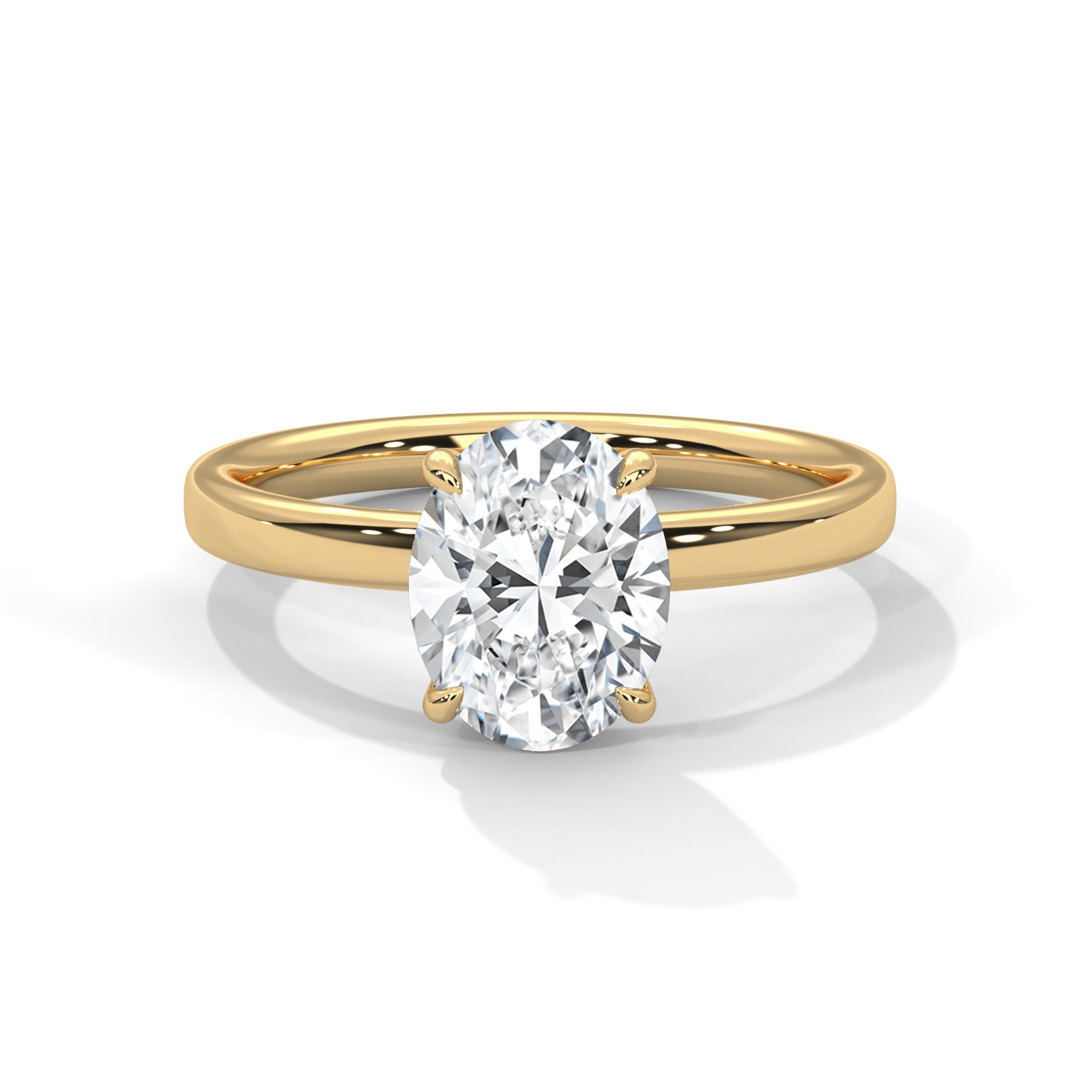 Oval solitaire plain band engagement ring in yellow gold, angled front view showing center stone and prong setting