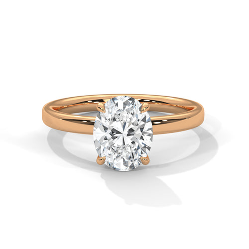 Oval solitaire plain band engagement ring in rose gold, three-quarter view showing oval center stone