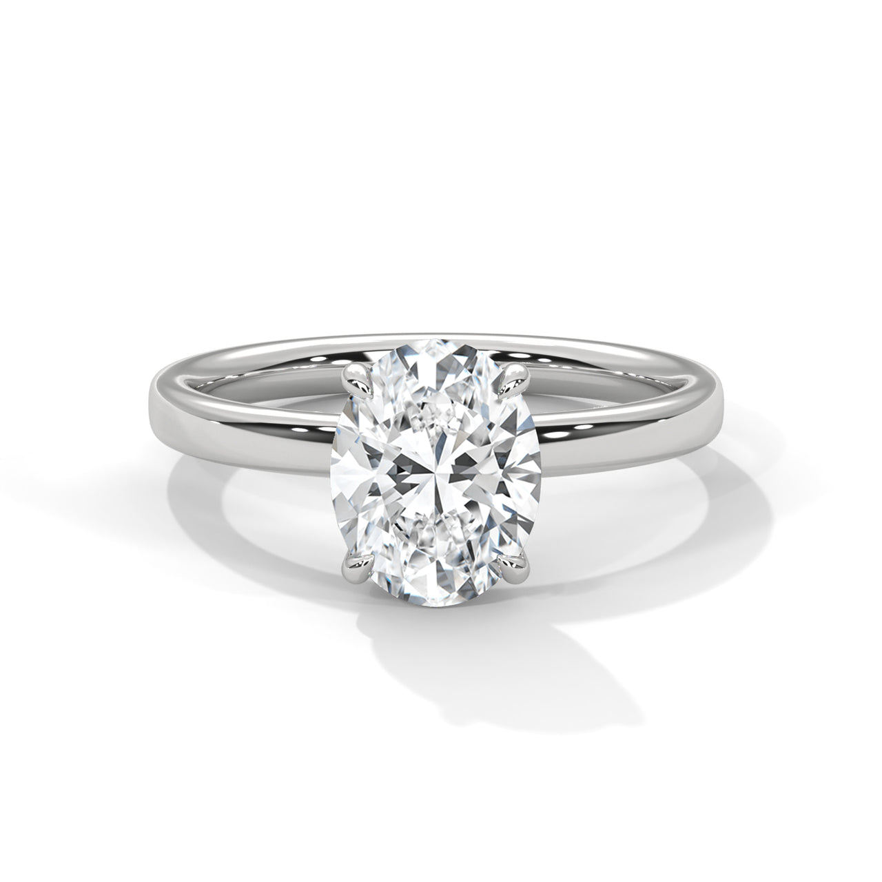 Oval solitaire plain band engagement ring in white gold, side profile view showing clean smooth band