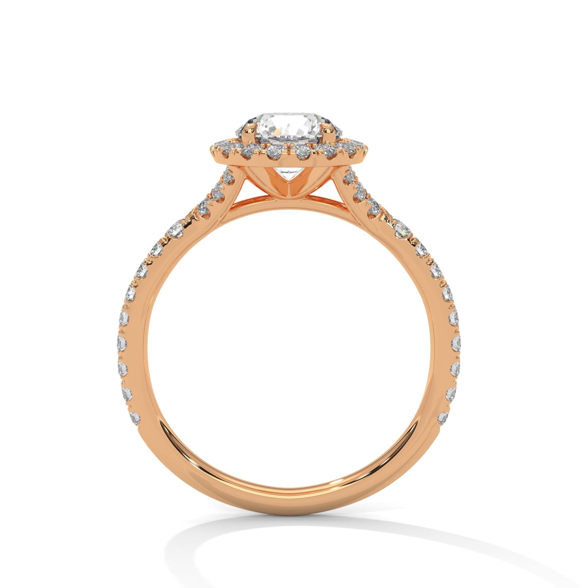 Rose gold round halo bridal ring featuring a delicate pavé band.