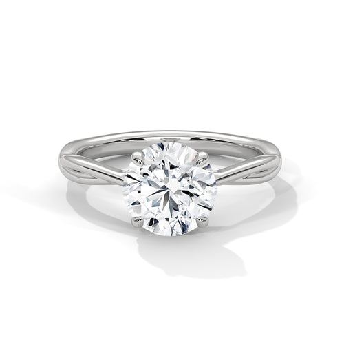 Round brilliant lab-grown diamond engagement ring featuring a twisted rope band and a polished white gold petal setting.