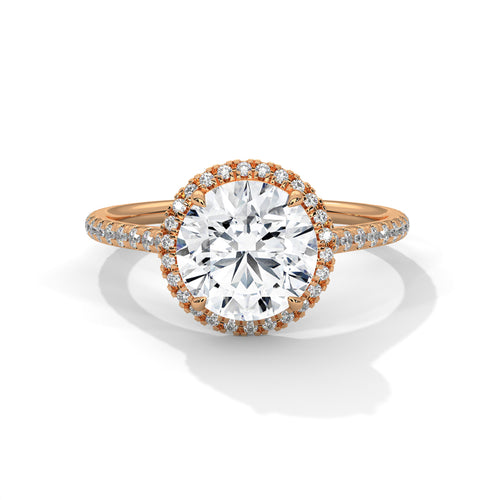 Round brilliant lab-grown diamond halo engagement ring with a pavé band in solid 18k rose gold.