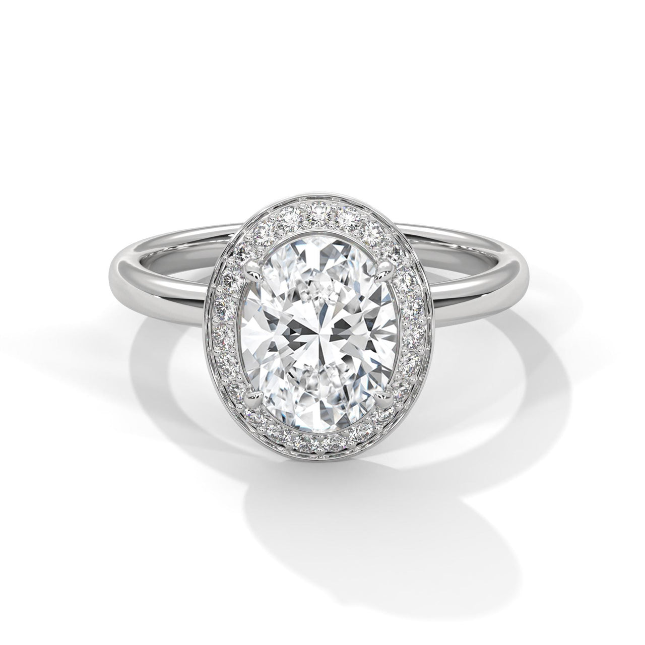 Oval cut lab grown diamond halo solitaire engagement ring in white gold