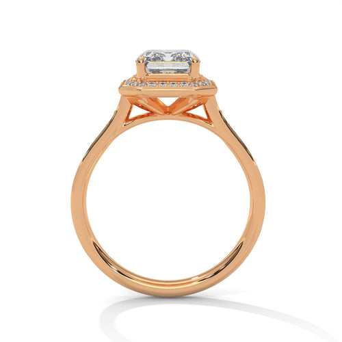 Rose gold emerald halo engagement ring featuring a pavé diamond shank