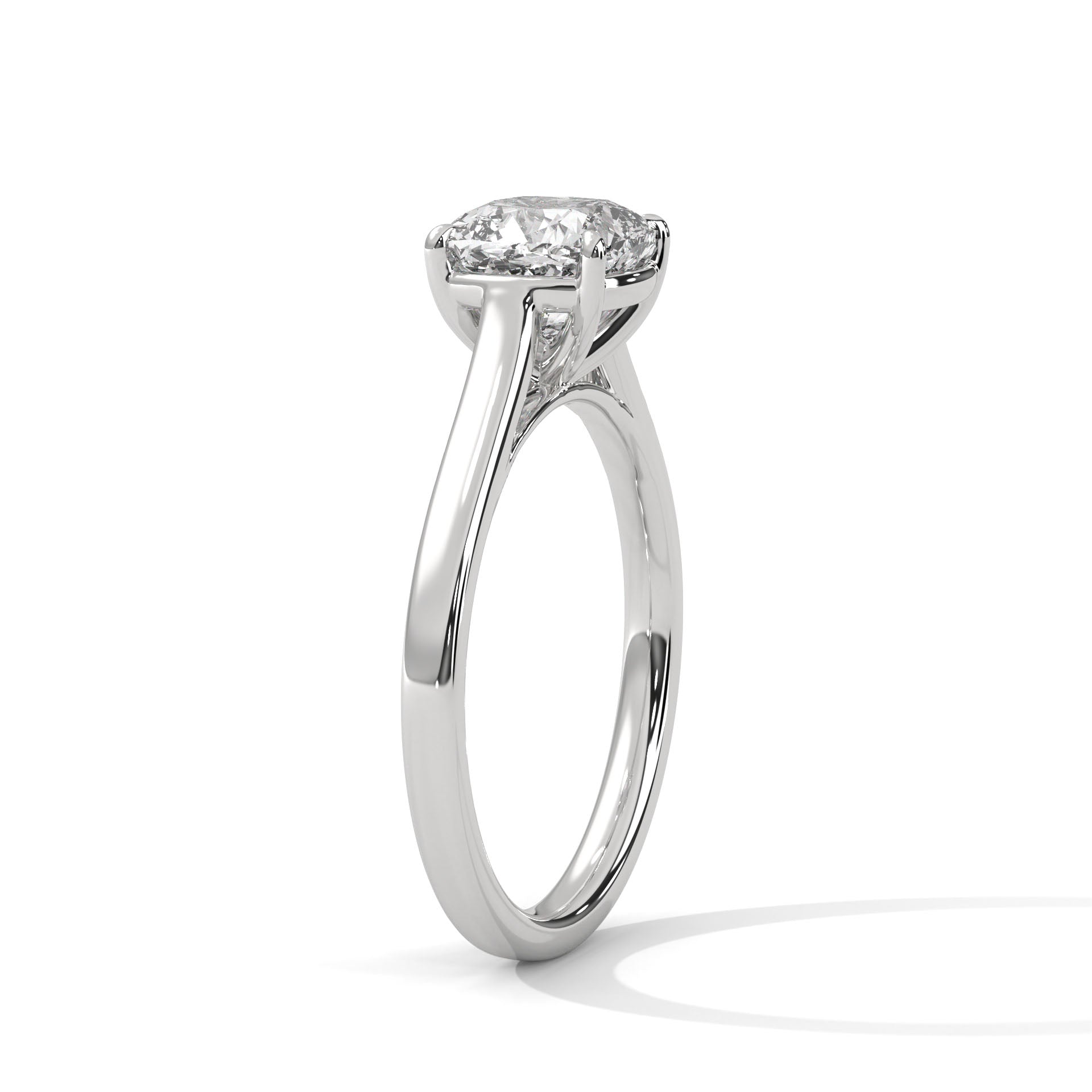 Perspective shot showing the crisp triangular ridge of the high-polish white gold knife-edge band and the prominent center cushion diamond.