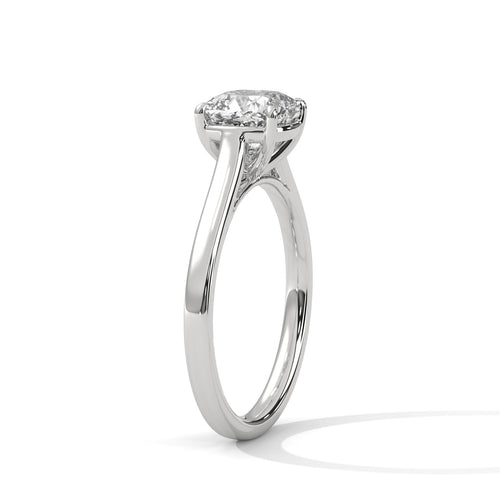 Perspective shot showing the crisp triangular ridge of the high-polish white gold knife-edge band and the prominent center cushion diamond.