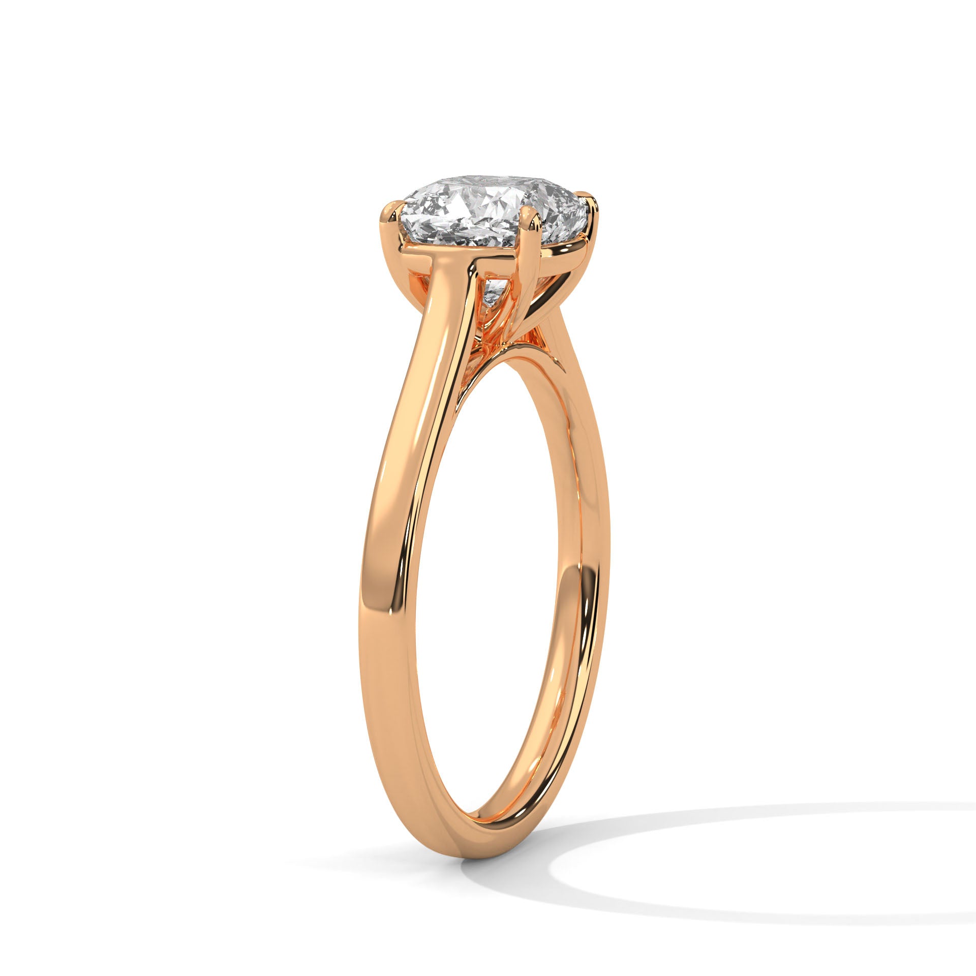 Perspective shot of a square cushion diamond solitaire on a high-polish rose gold knife-edge band.