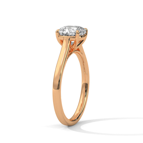 Perspective shot of a square cushion diamond solitaire on a high-polish rose gold knife-edge band.