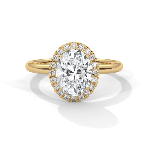 Oval brilliant lab grown diamond pave halo engagement ring in yellow gold