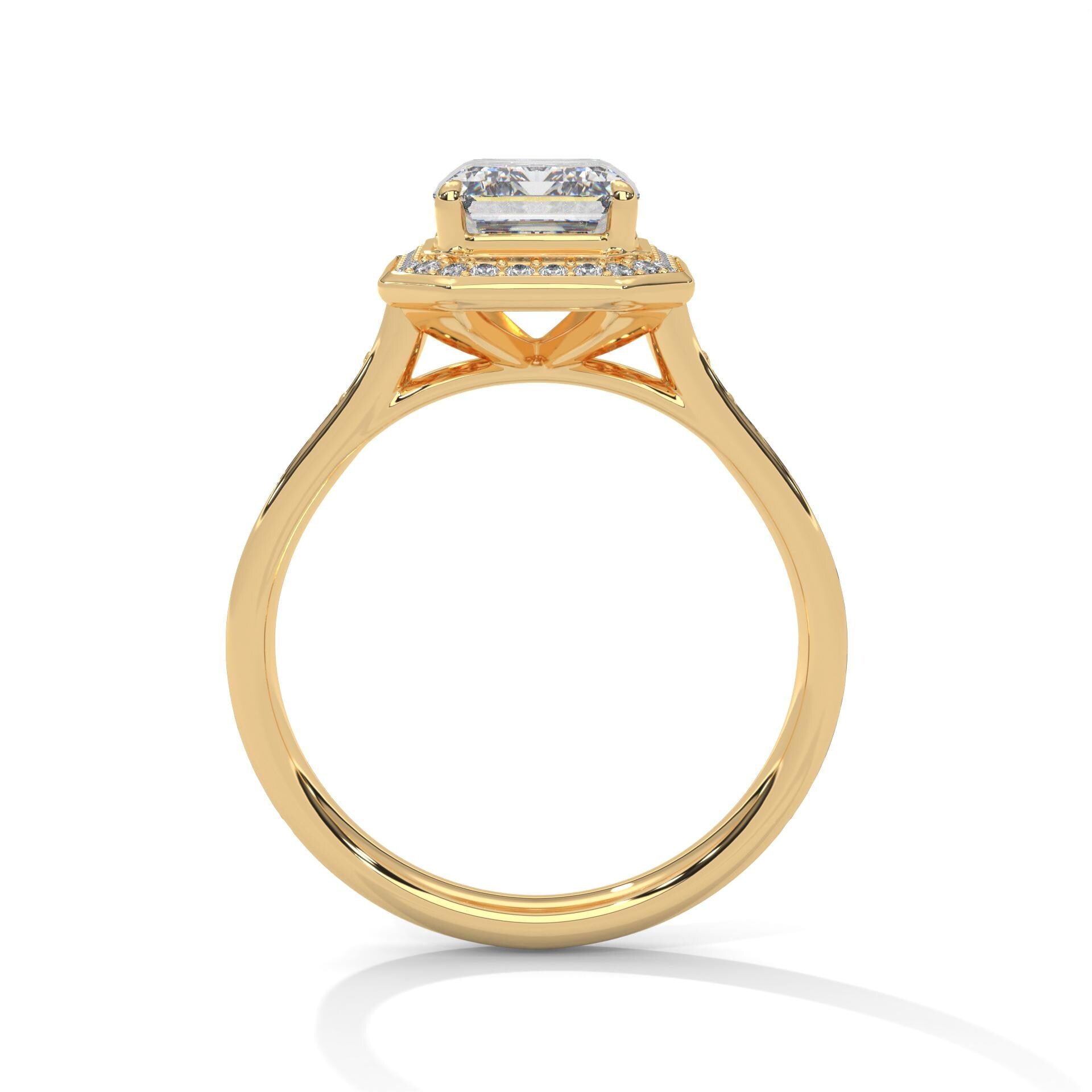 Side view of yellow gold emerald halo ring showing elegant cathedral arches