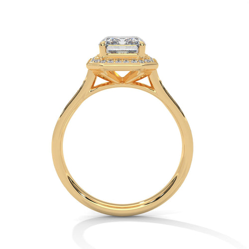 Side view of yellow gold emerald halo ring showing elegant cathedral arches