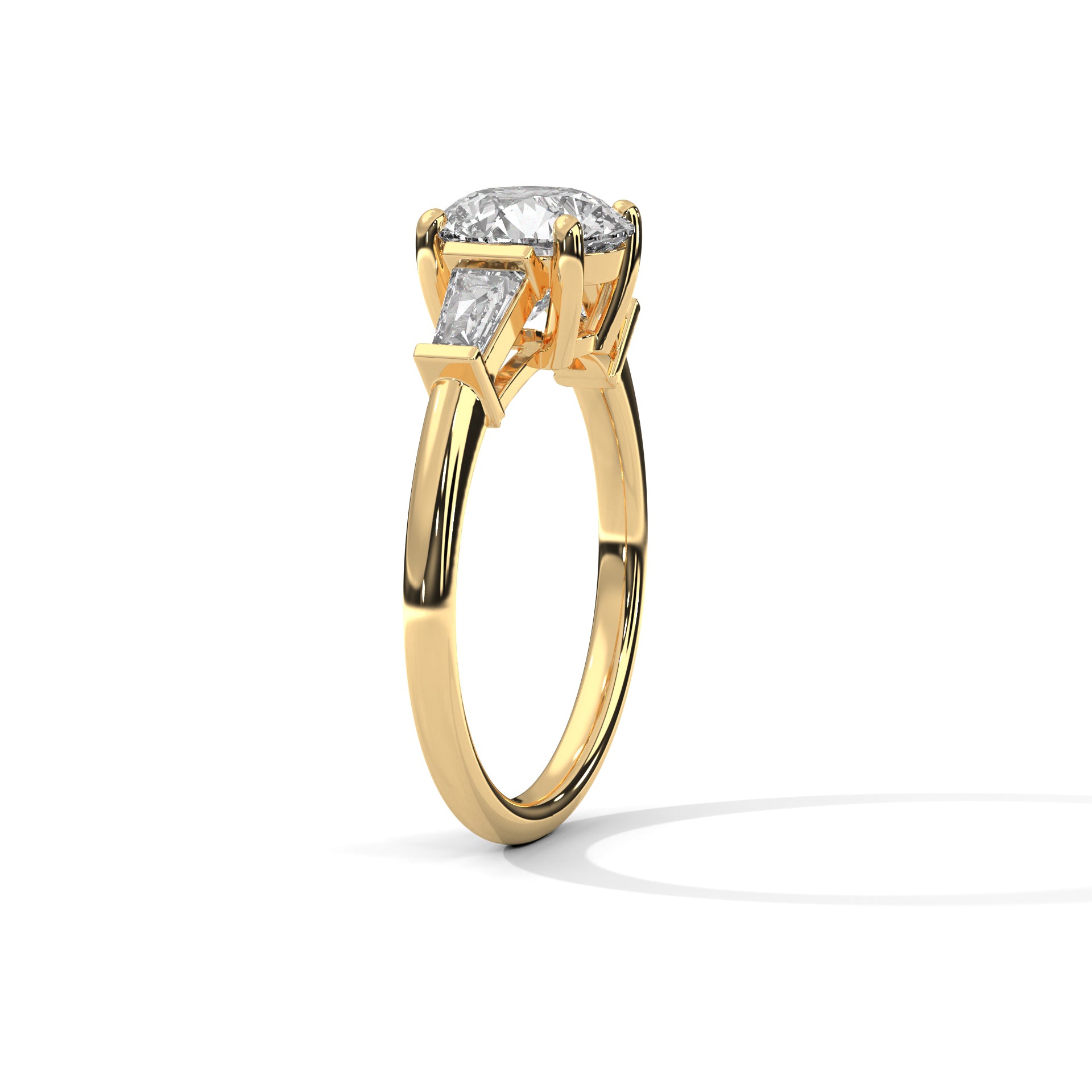 Three-quarter angled view of the solid yellow gold three-stone ring showing how the shank tapers upward toward the diamond setting.