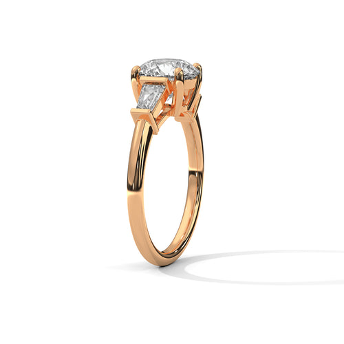 Three-quarter angled view of the rose gold three-stone ring detailing the high-polish finish and secure claw setting.