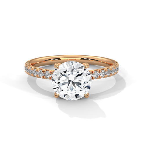 Round brilliant hidden halo pavé engagement ring in rose gold, front view