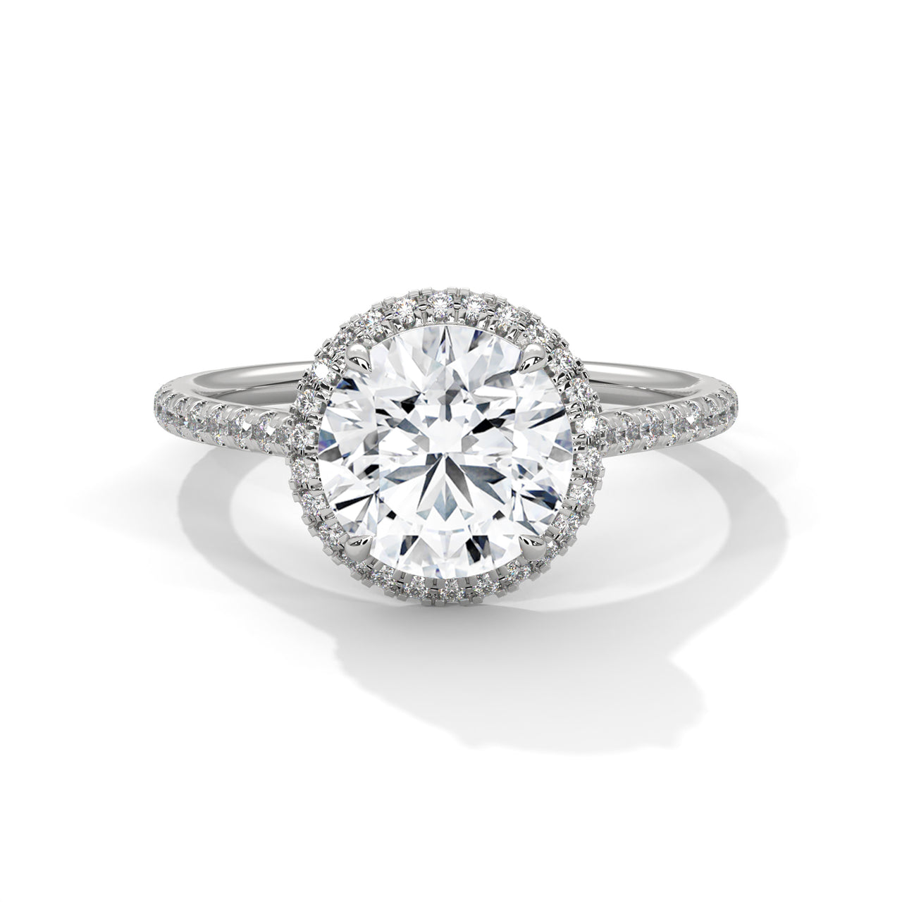 Round brilliant lab-grown diamond halo engagement ring with a pavé-set diamond band in solid white gold.