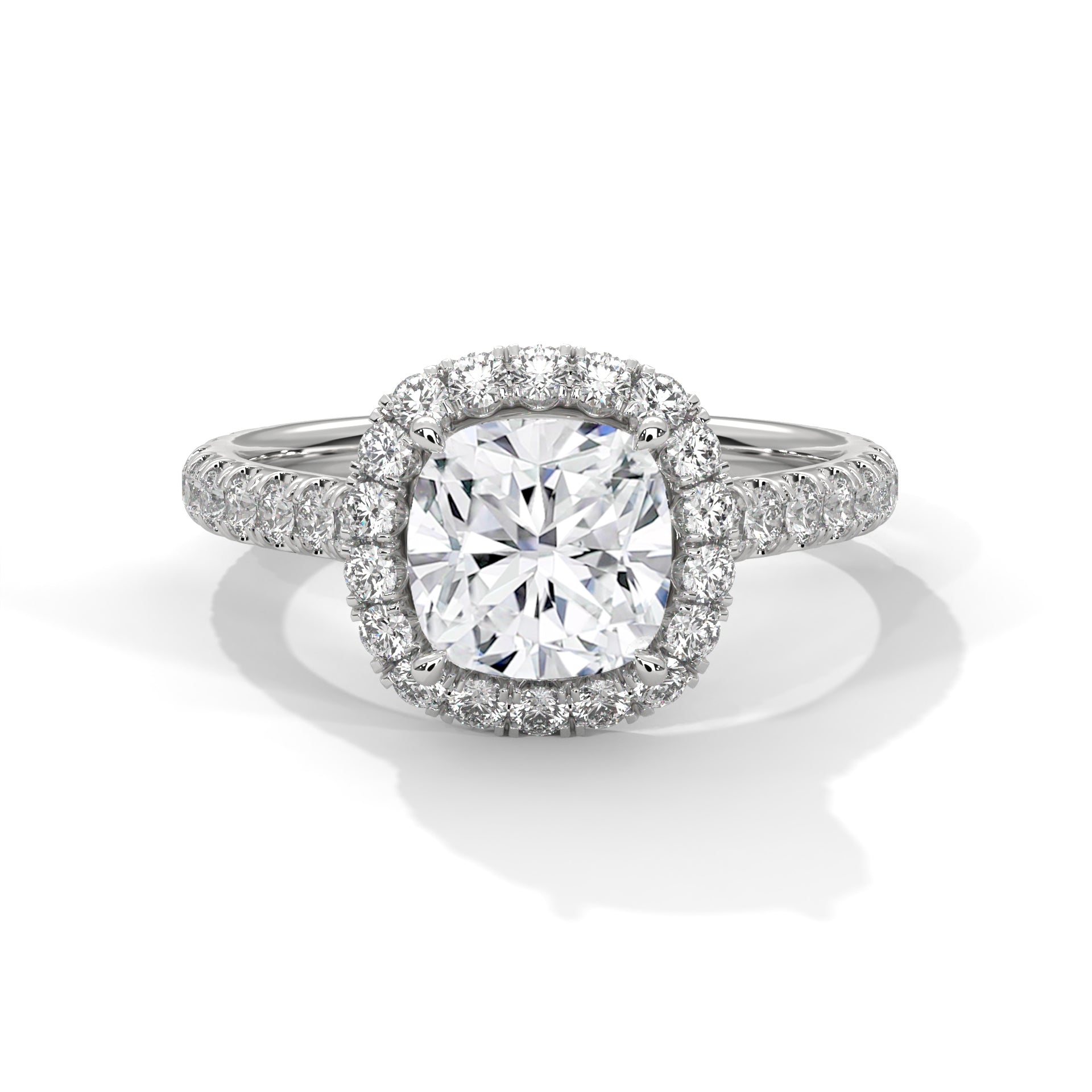 Cushion cut lab-grown diamond solitaire engagement ring featuring a hidden halo collar and a polished white gold knife-edge band.