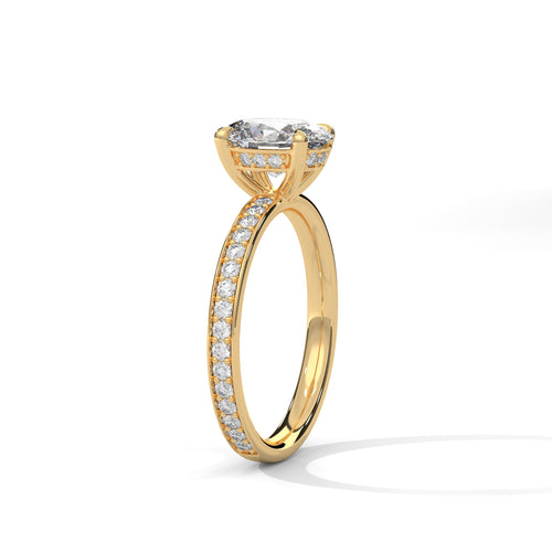 Oval hidden halo micropavé engagement ring in yellow gold, side profile view highlighting slim pavé band