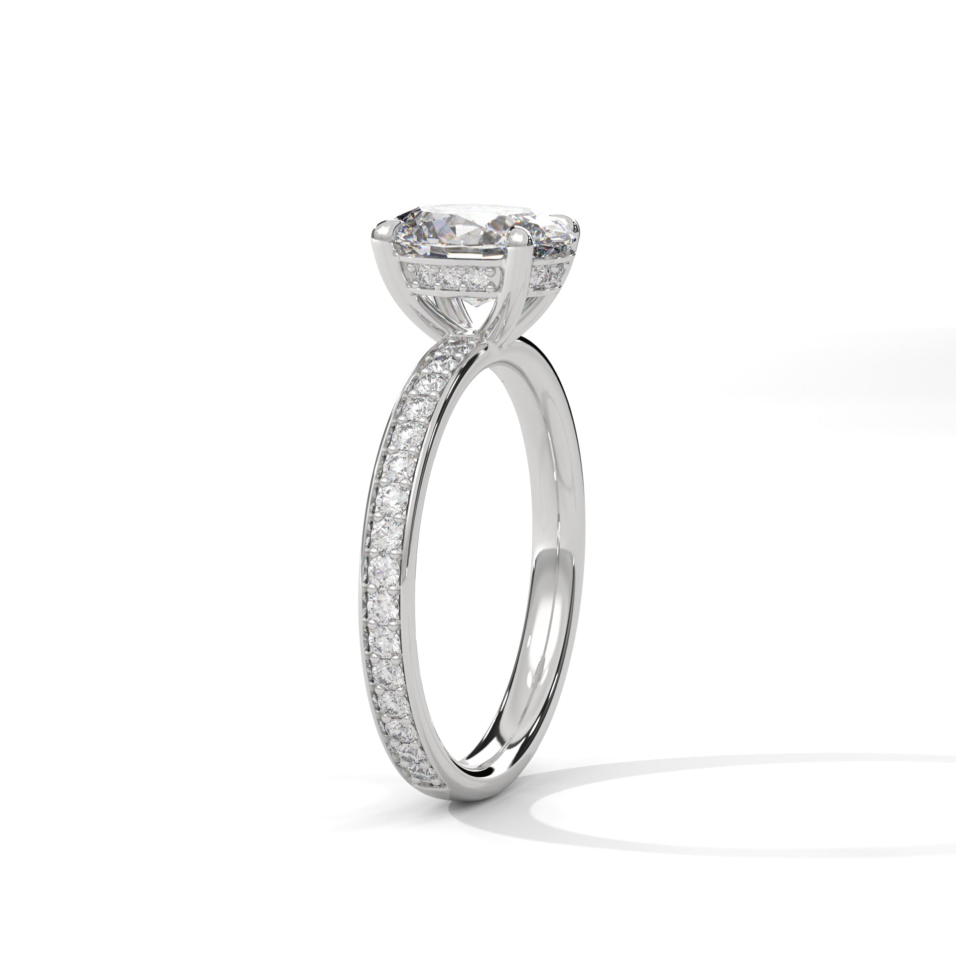 Oval hidden halo micropavé engagement ring in white gold, angled side view showing band profile