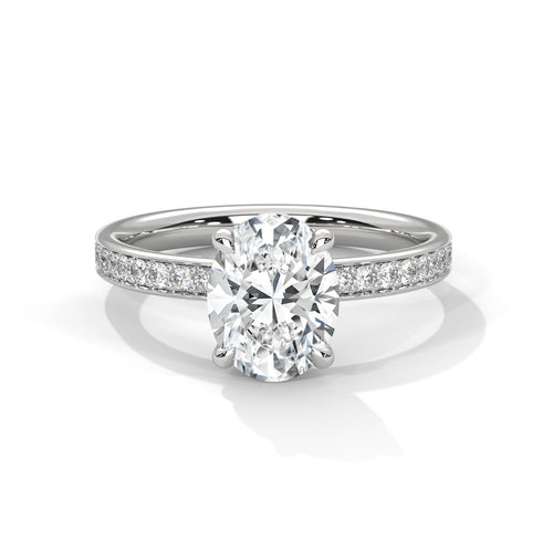 Oval hidden halo micropavé engagement ring in white gold, side profile view showing full pavé band
