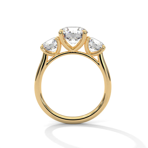 Round brilliant three-stone trilogy engagement ring in yellow gold, front view showing three round brilliant diamonds