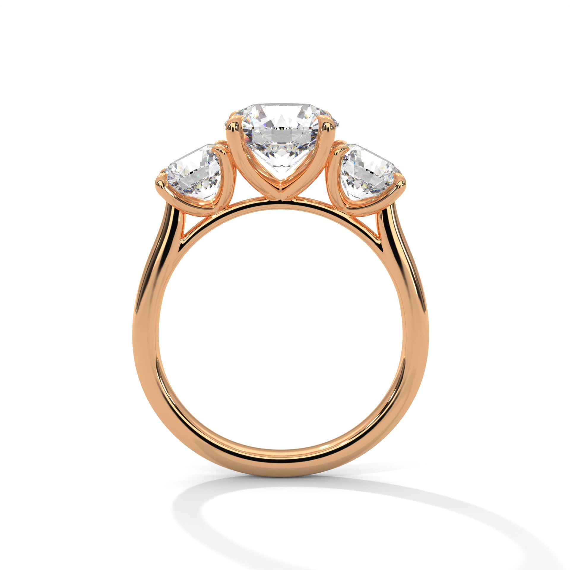 Round brilliant three-stone trilogy engagement ring in rose gold, front view showing three-stone setting and band
