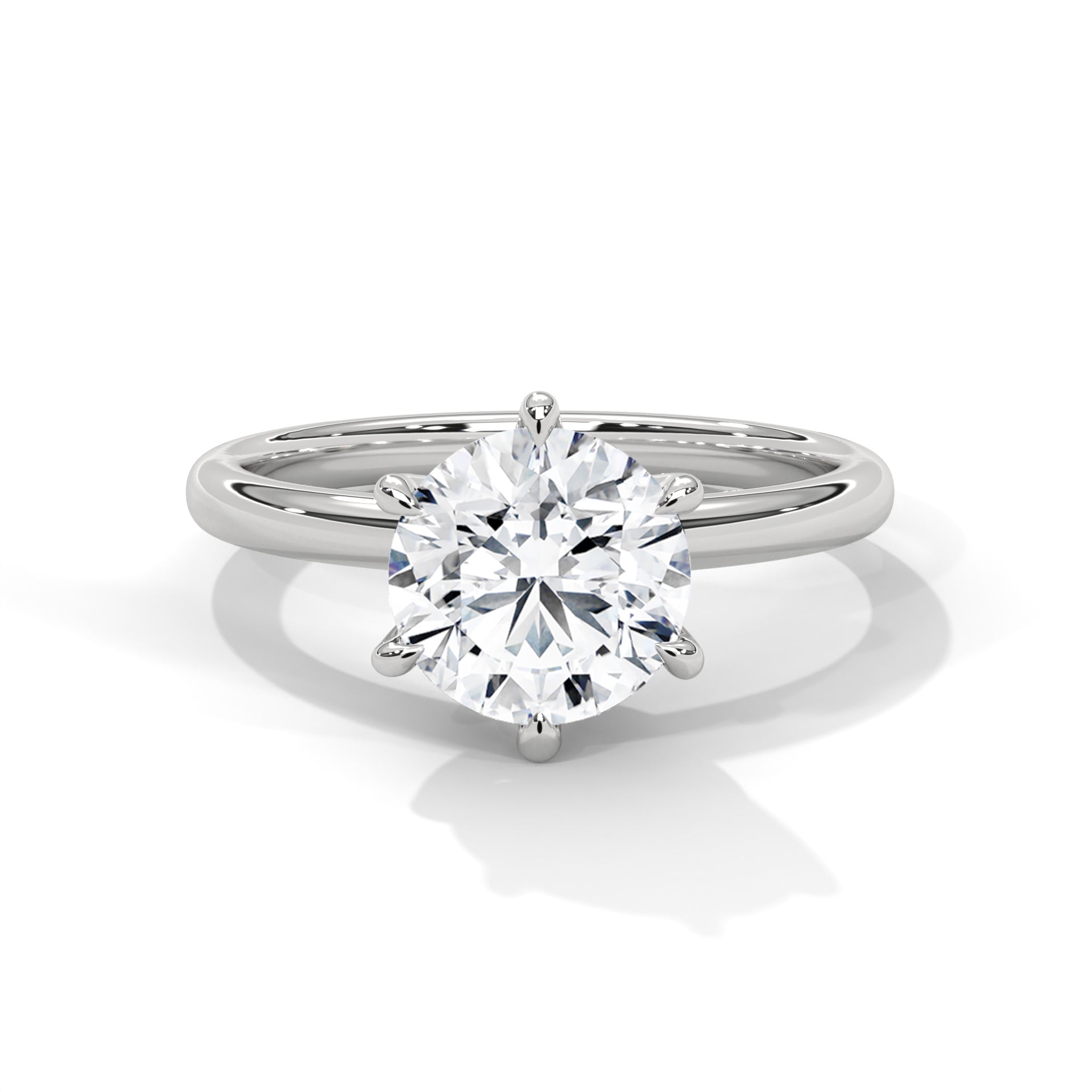 Round brilliant six-prong crown solitaire engagement ring in white gold, side profile view showing hexagonal basket and plain band