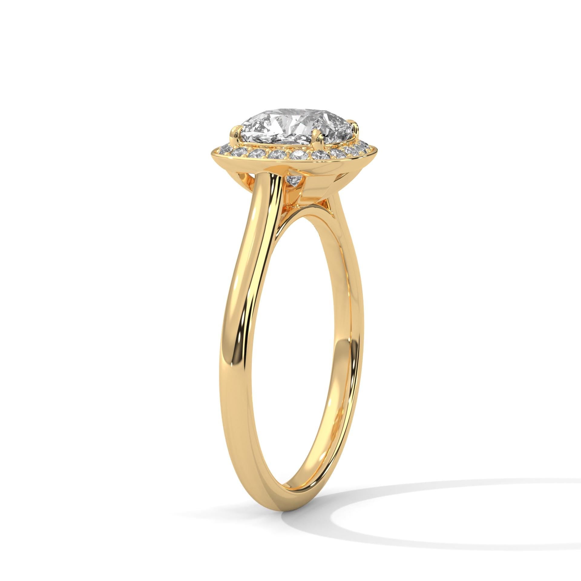 Detail view of cushion cut diamond halo in solid 18K yellow gold