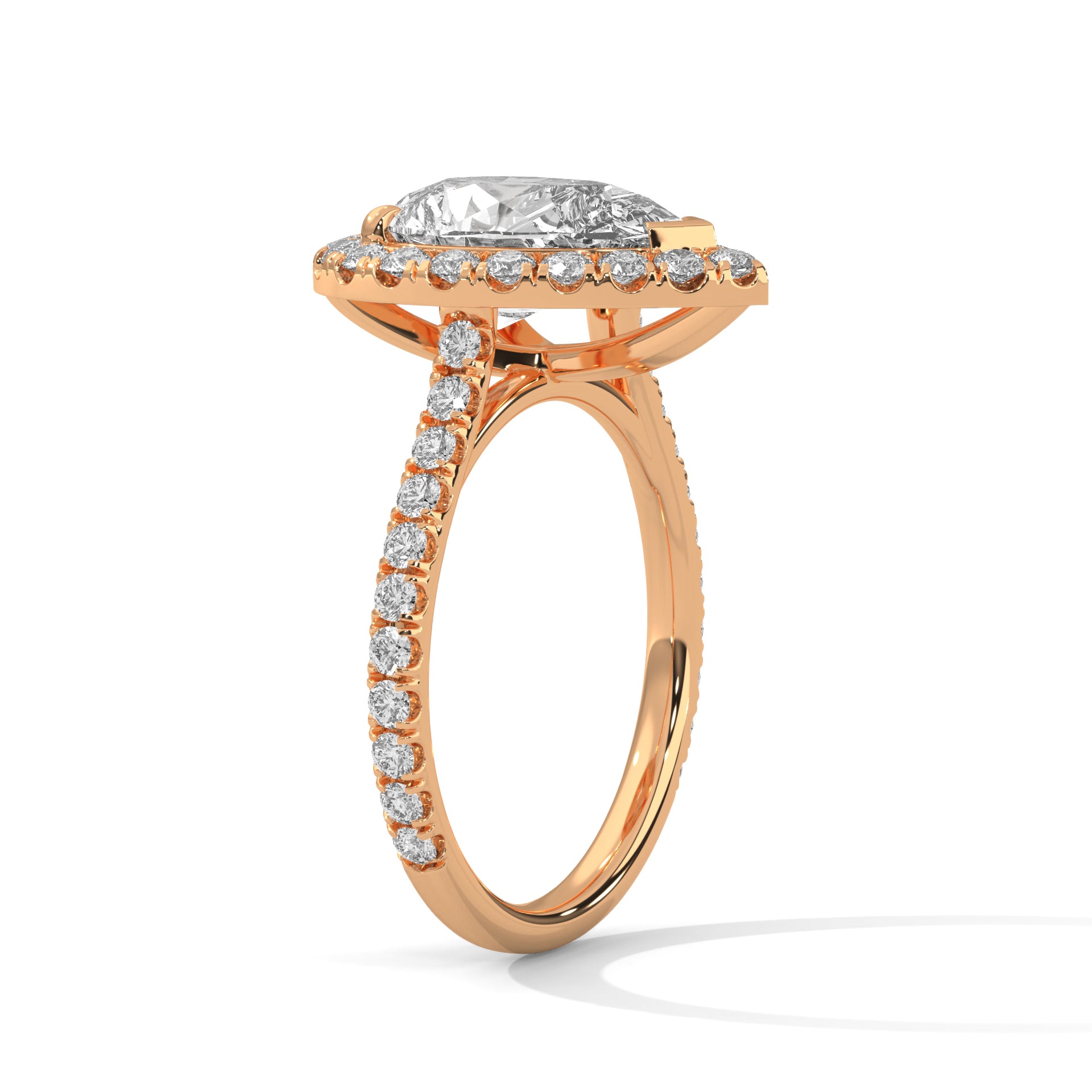 Pear cut bezel-edge floating halo engagement ring in rose gold, side profile view showing V-prong head and cathedral column setting