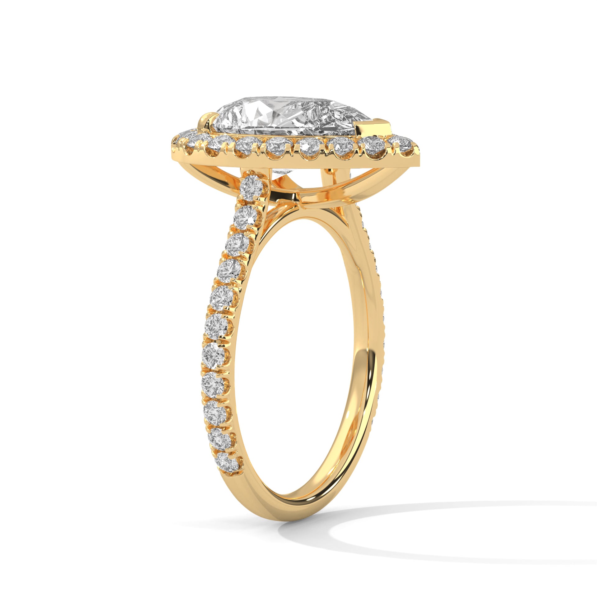Pear cut bezel-edge floating halo engagement ring in yellow gold, angled front view showing floating halo and French pavé band