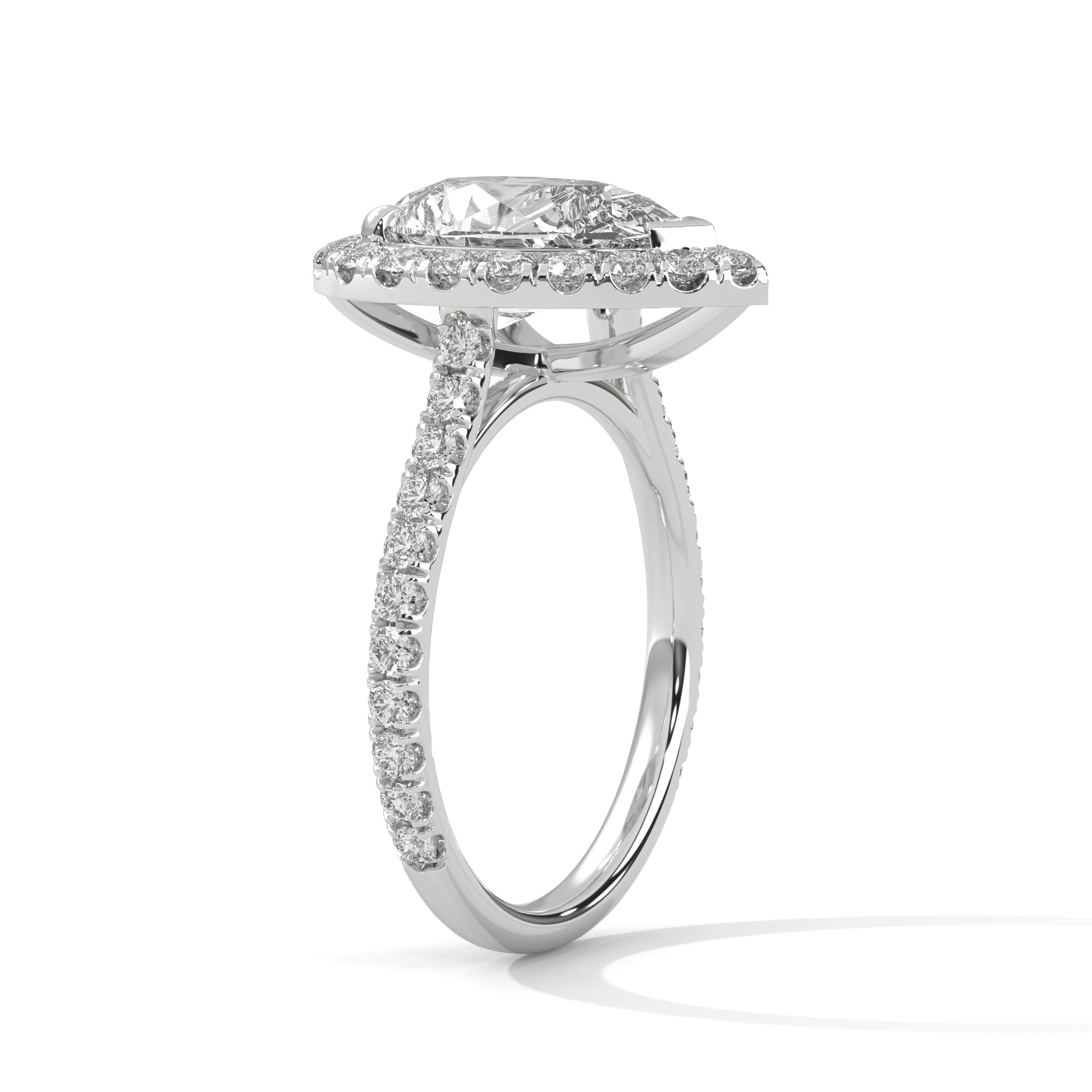 Pear cut bezel-edge floating halo engagement ring in white gold, angled side view showing V-prong head and raised platform halo shelf