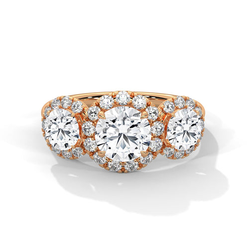 1 to 3 carat three-stone round lab diamond halo ring in rose gold