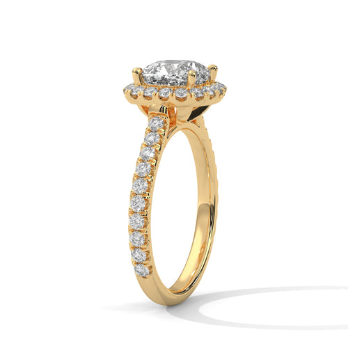 Angled perspective of a radiant cut solitaire ring in yellow gold highlighting the light-reflective sloped band.