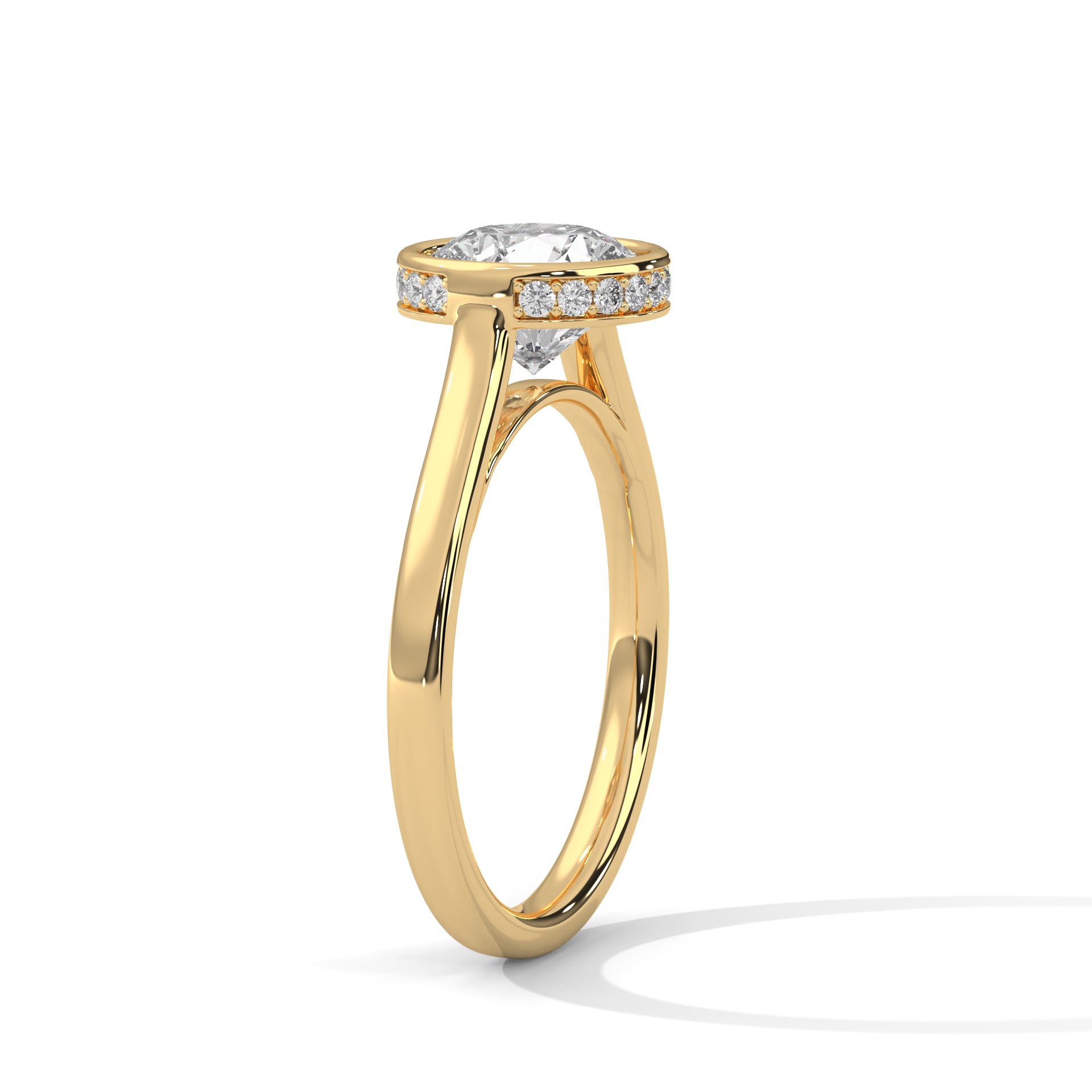 Angled perspective of a tapered yellow gold band narrowing gracefully toward the circular bezel setting.