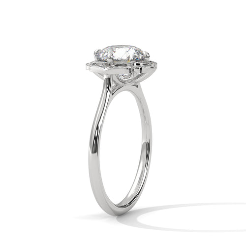 Perspective shot highlighting the petal-like scalloped halo and sleek white gold band.