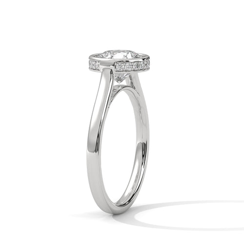 Perspective shot highlighting the high-polish tapered white gold band and the clean metal border framing the center stone.