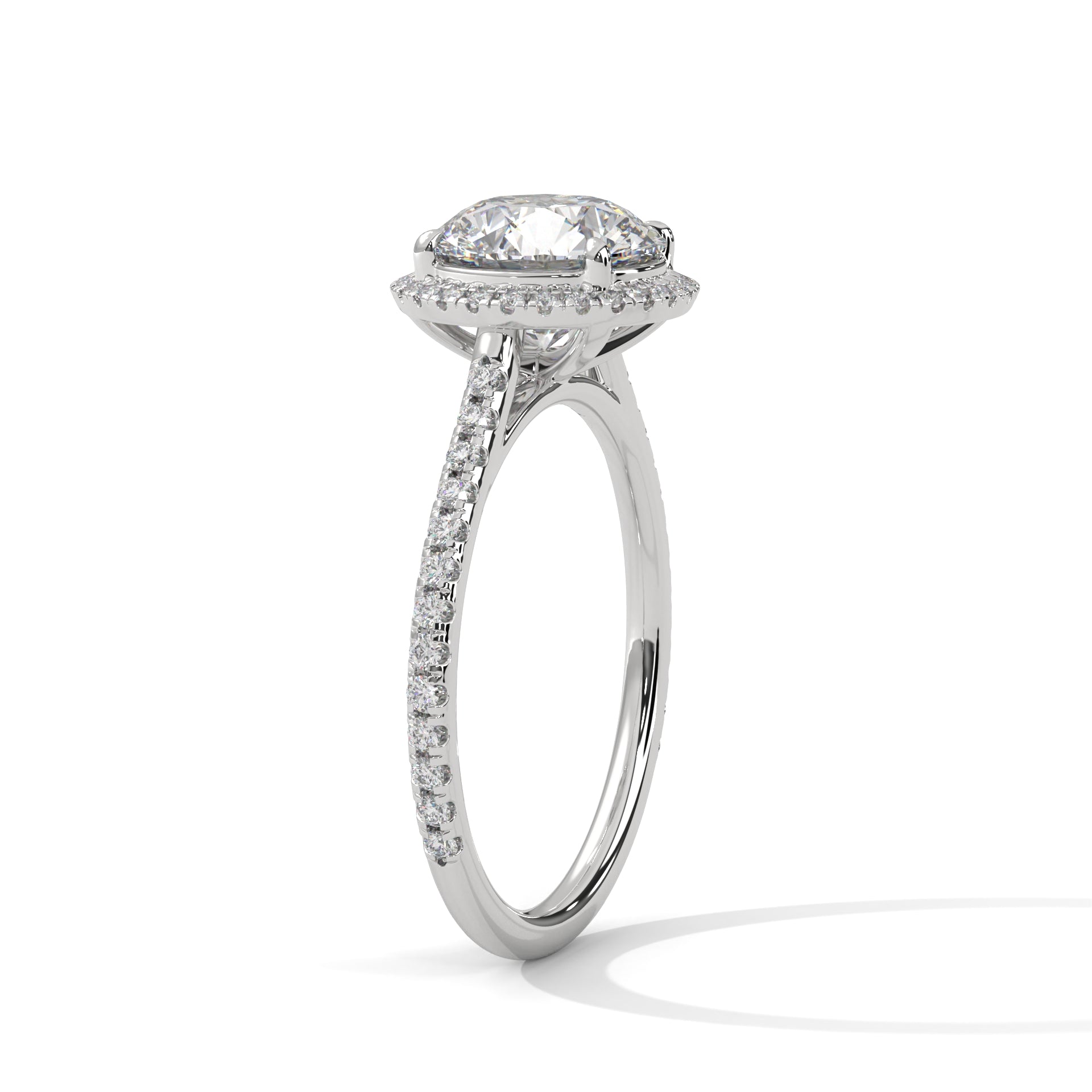 Perspective shot showing the diamond halo and shimmering pavé band in white gold.