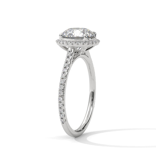 Perspective shot showing the diamond halo and shimmering pavé band in white gold.